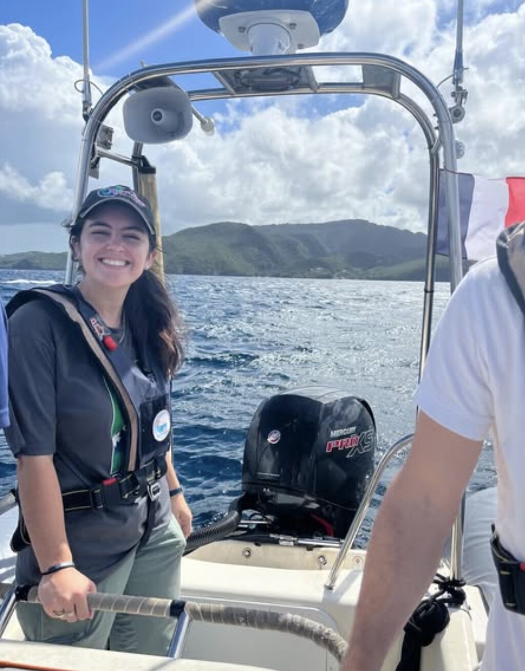 Jacquelyn Veatch smiling aboard a small research boat near Martinique