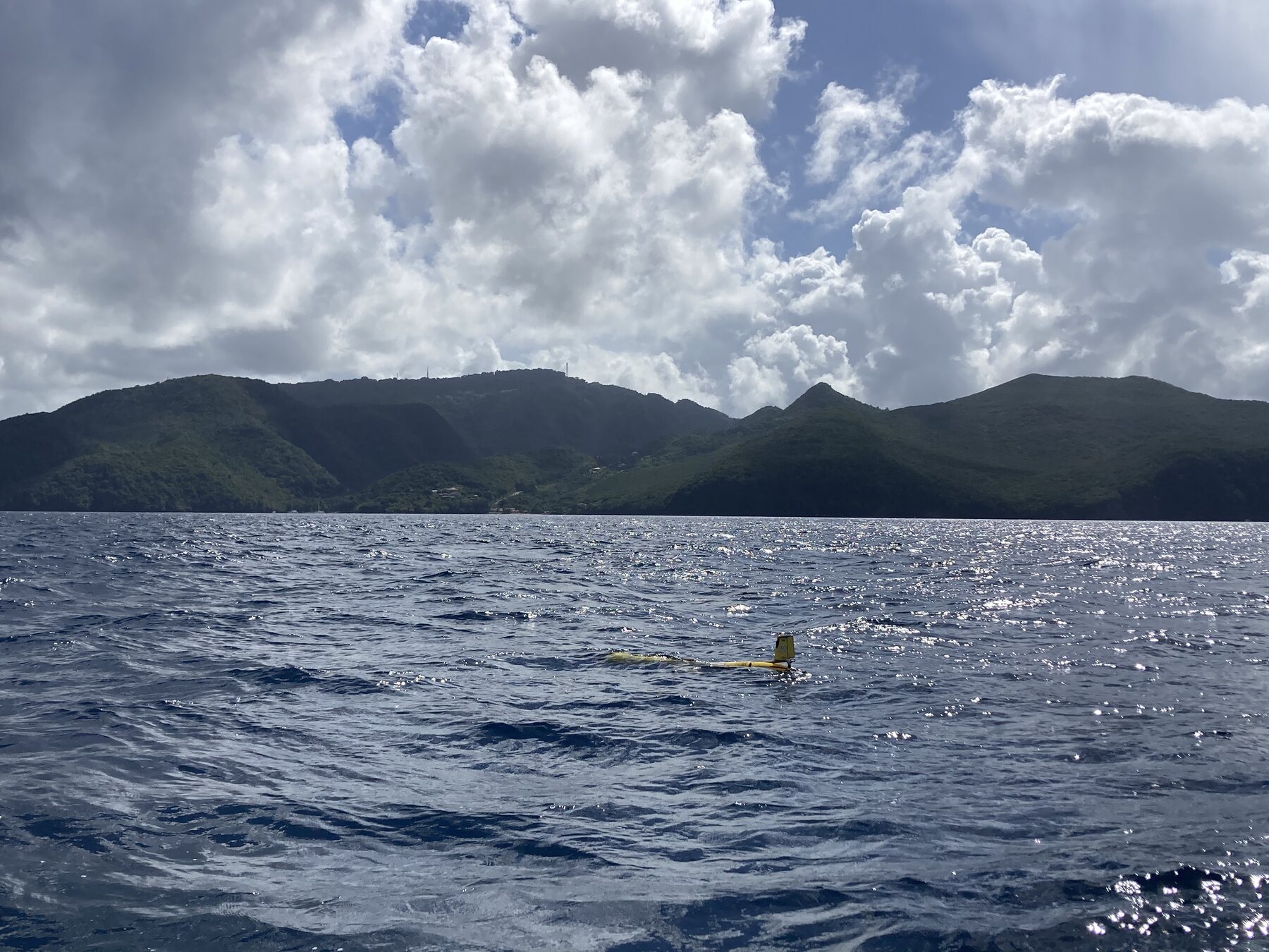 A Slocum glider operating in the ocean near the mountainous coast of Martinique